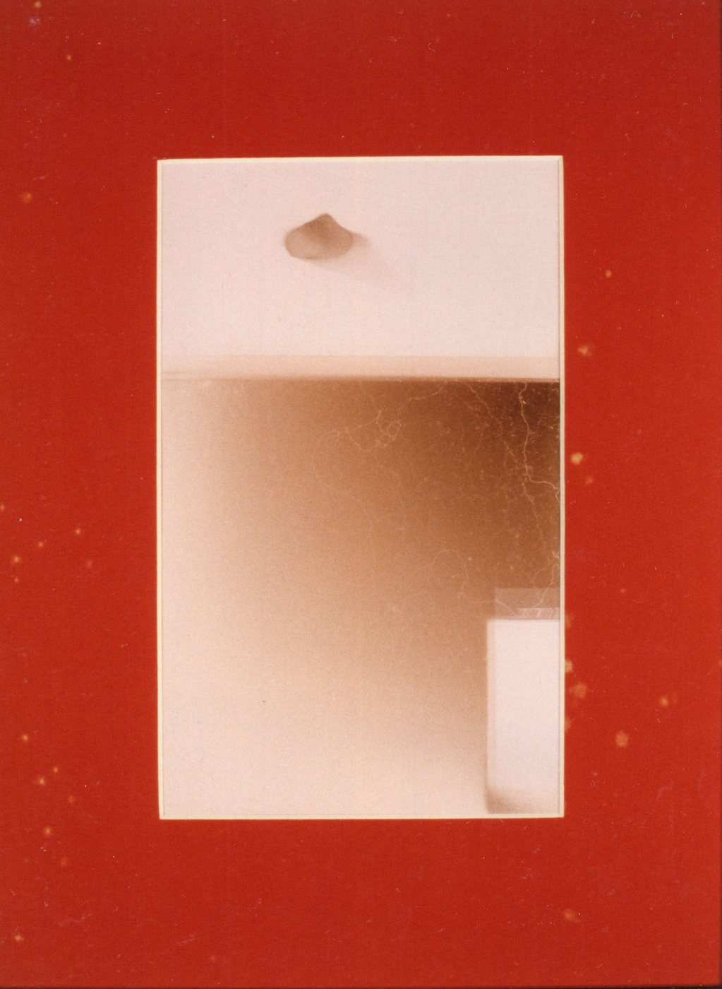 &Eacute;&eacute;n Steen, 1987 - a pale luminous rectangle set into a vivid red ground, a small stone form resting at its top edge.